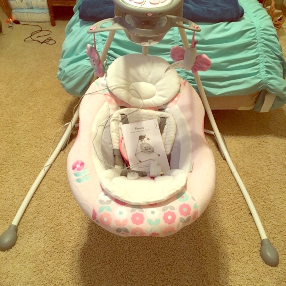 Baby's white and pink ingenuity cradle and swing